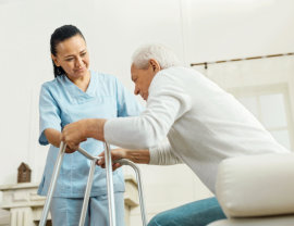 caregiver guiding senior man