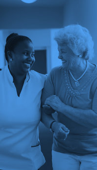 caregiver smiling with senior woman